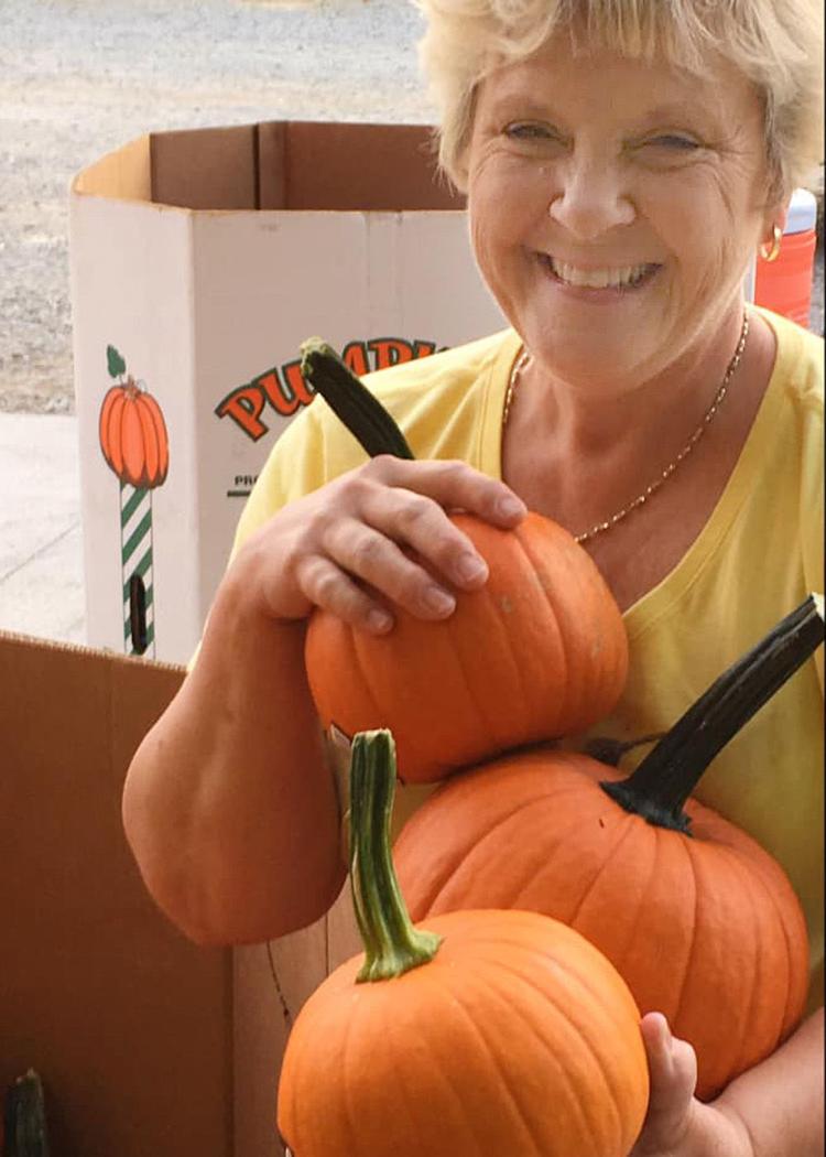 Starr Farms grows about 500 acres of pumpkins each year. Pattie Starr is pictured with some of the crop. The farm is opening a 150-year-old house there where people can stay for a short vacation and learn about the farm’s operations. Photo provided