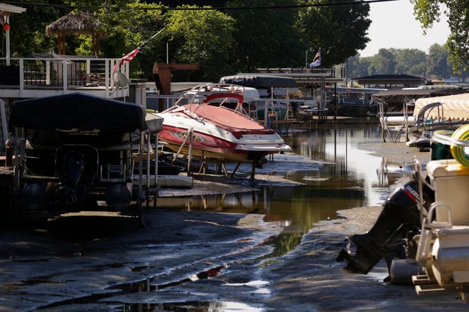 Boats sit well above the water level of the Tippecanoe River on a man-made canal, Friday, Sept. 4, 2020 in Monticello. Nikos Frazier | Journal & Courier