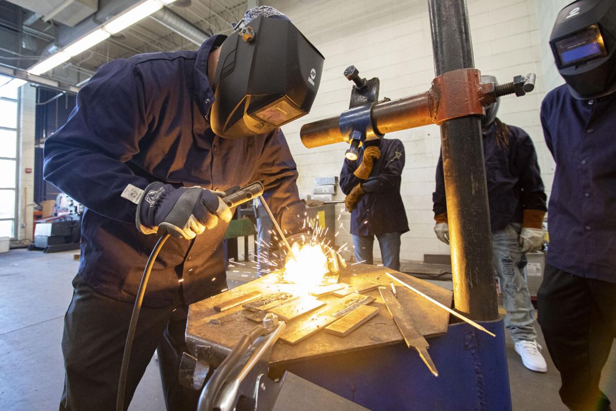 Welding instructor Cole Keller demonstrated techniques to his class at Ivy Tech Community College in South Bend on Monday, Aug. 31, 2020. Staff photo by Joseph Weiser