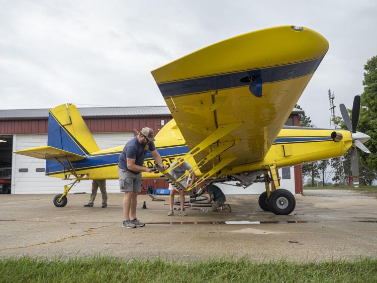 In this file photo from October 2019, a pilot of AgriFlite Services prepares a plane to spray insecticide to kill mosquitoes in Elkhart County after a health emergency declaration involving the spread of Eastern Equine Encephalitis. Staff photo by Joseph Weiser