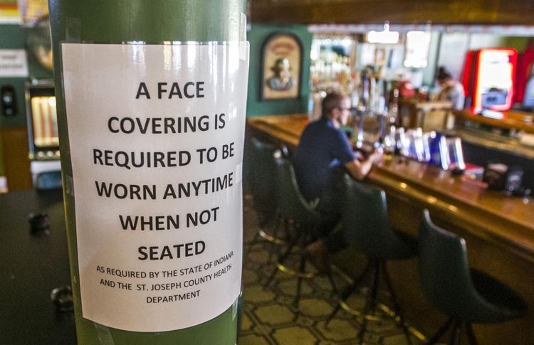 Signs posted throughout Phoenix Bar & Grill in Mishawaka remind patrons of health protocols in place to stop the spread of the novel coronavirus. 
Tribune Photo/ROBERT FRANKLIN