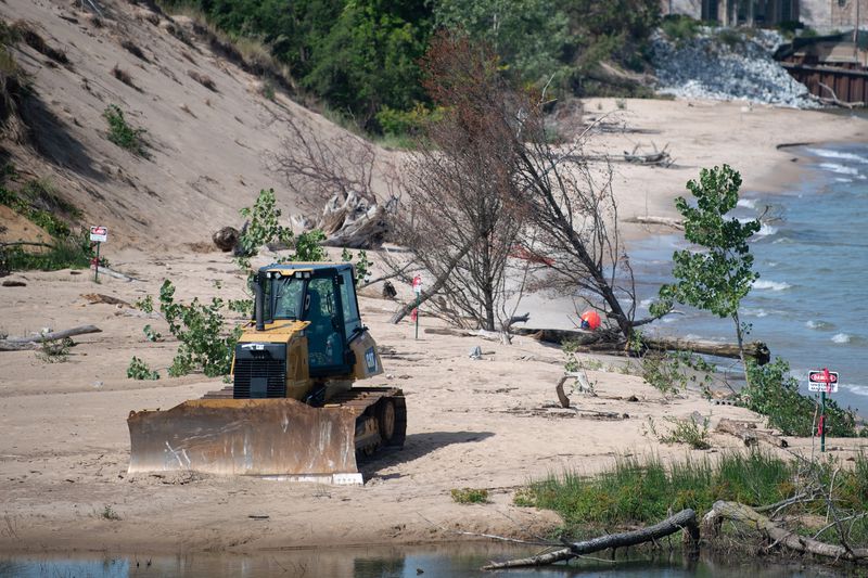 A bulldozer used in continuing erosion mitigation at Portage Lakefront and Riverwalk sits parked near the shore Wednesday, September 2, 2020. (Kyle Telechan / Post-Tribune)