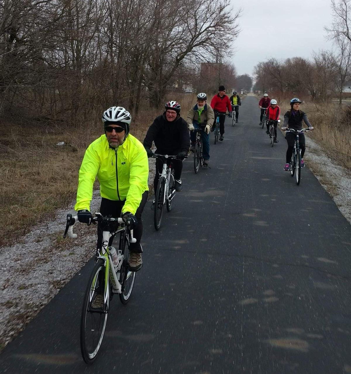 Cyclists ride the Panhandle Pathway south of Winamac on a brisk day.  Photo provided