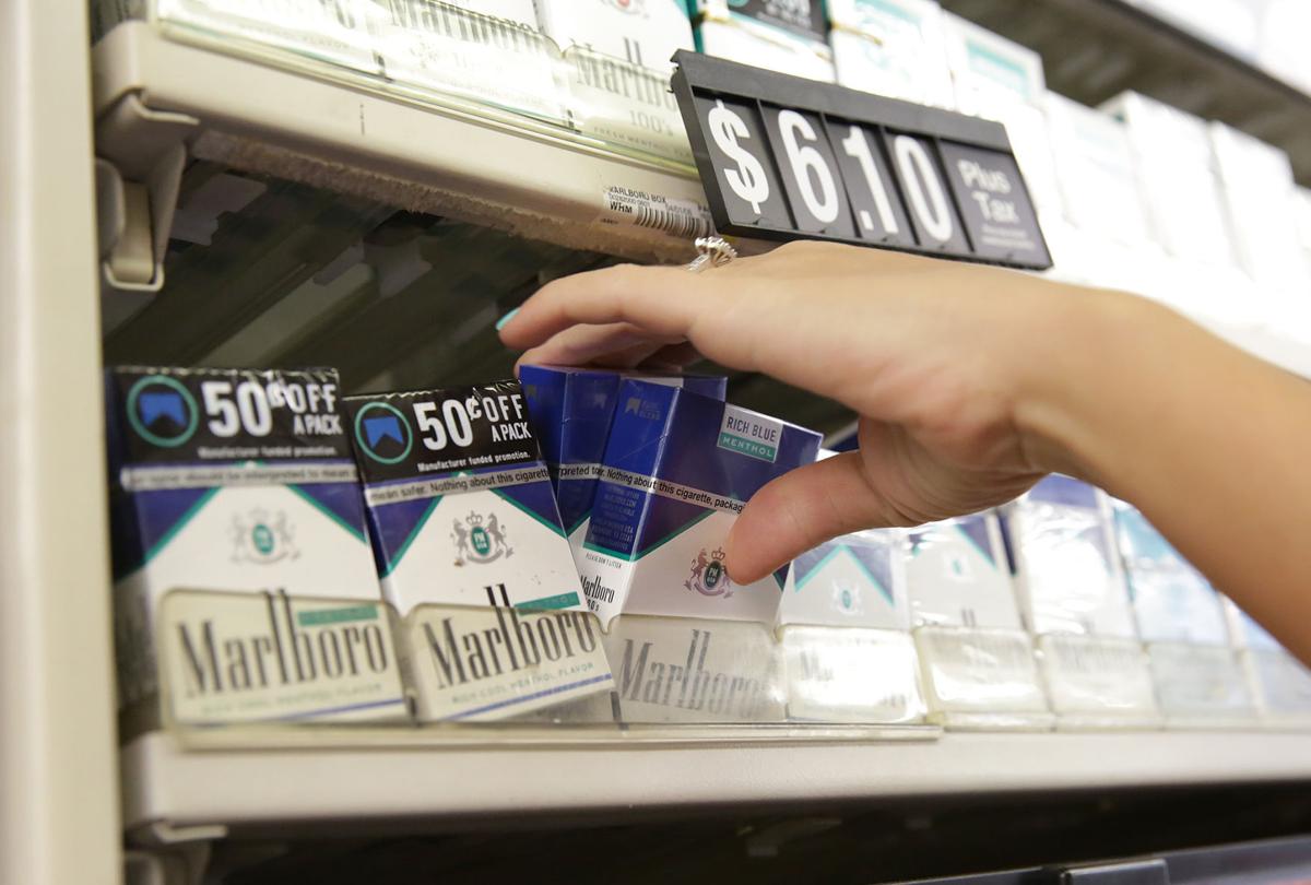An employee pulls cigarette packs in March 2017 at Sam's Smoke Shop in Whiting. Indiana has one of the highest smoking rates in the nation. Staff file photo by Jonathan Miano

Jonathan Miano, Times file photo