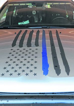 The hood of Nashville Metropolitan Police Department vehicles is decorated with the Thin Blue Line flag. Staff photo by Sara Clifford 