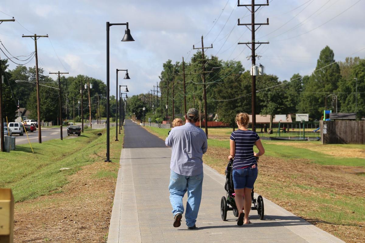 A family enjoyed the new Discovery Trail in Clarksville in a walk this fall. Staff photo by Brooke McAfee