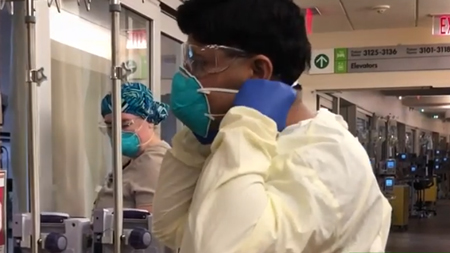 Parkview Regional Medical Center ICU Director Dr. Hariom Joshi puts on a mask before seeing patients in a screencapture taken from a video log he made in May 2020 about his experiences treating COVID-19 patients.