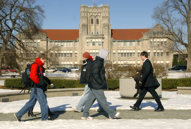 Students walk to class passed the Olmsted Administration Hall on The University of Evansville campus. Staff photo by Erin McCracken