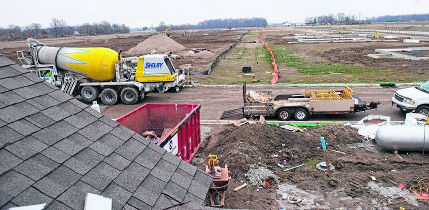 Another rooftop overlooks neighboring lots awaiting home construction in Fortville. The neighborhood off County Road 200N is part of a building boom in the area. (Tom Russo | Daily Reporter)