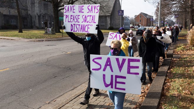 University of Evansville students and faculty march down the sidewalk on Lincoln Avenue, adjacent to campus, as they protest UE President Christopher Pietruszkiewicz’s announcement of a plan that would eliminate 17 majors and lead to the departure of a quarter of the faculty Tuesday morning, Dec. 15, 2020.
MaCabe Brown / Courier & Press