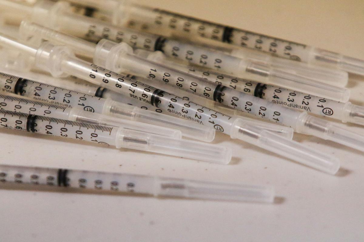 Needles are unpacked for COVID-19 vaccinations on Jan. 11, 2021, at the AHEPA apartments in Merrillville. Kale Wilk, file, The Times
