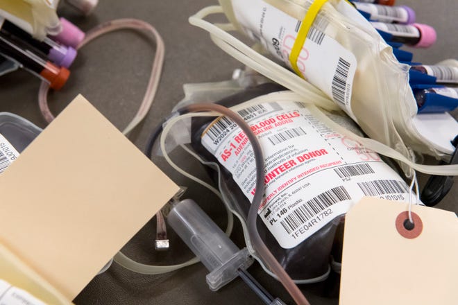 Blood bag wait to be processed at the Red Cross of Southern Indiana in March 2020. Deaconess Health Systems leadership and the local Red Cross chapter have put out a call for blood donors amid a critical national shortage. Staff file photo by MaCabe Brown