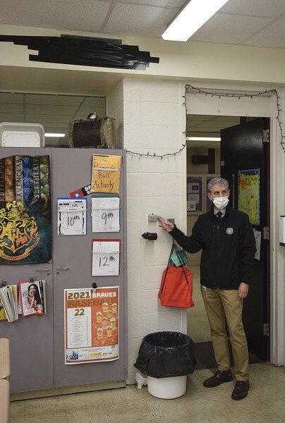 Vigo County School Corp. Superintendent Rob Haworth shows how one teacher taped over the vent in her classroom because of the old HVAC system during a tour Nov. 16, 2021. Staff file photo by Joseph C. Garza
