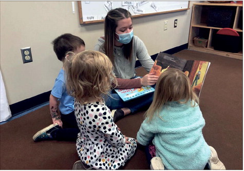 Keegan Berry, a preschool teacher with IU Early Day Learning in Indianapolis, reads aloud to students.
photo by Whitney Downard | CNHI Statehouse Reporter