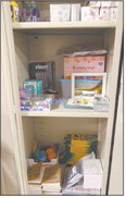 Tipton Middle School also has a cabinet stocked with fidgets, coloring books, stress balls and other activities for students who use the calming room. School staff said the calming room is helping students learn what works best for them to self-regulate. Staff photo by Tim Bath
