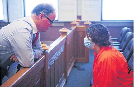 Hancock County Superior Court 1 Judge D.J. Davis, who pushed for creation of the new court program, confers with Jennifer Coomer, who will be part of the program over the coming weeks. Tom Russo | Daily Reporter