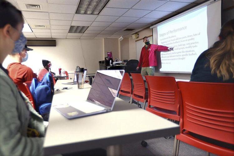 Listening: Indiana University Kokomo’s Steve Eby teaches an education class Wednesday evening. Staff photo by Tim Bath
