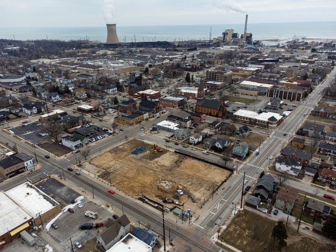 A developer plans to build apartments, a train station and parking garage in the vacant Michigan City block between 10th and 11th and Pine and Franklin streets, seen in the foreground. MICHAEL CATERINA/SOUTH BEND TRIBUNE