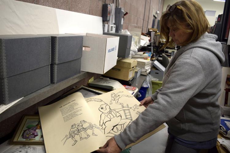 Red Skelton Museum of American Comedy Executive Director Anne Pratt sorts through stacks of Red Skelton’s sketches and hand-drawn cartoons Monday afternoon, ones that will be set up alongside a new traveling exhibit set to be erected there on March 15. From Pencils to Pixels is a traveling exhibit drawn from the collections of the Indiana Historical Society and the Indiana State Library, among other institutions, and examines the life and work of some of Indiana’s most famous cartoonists. Sun-Commercial photo by Jill Erwin