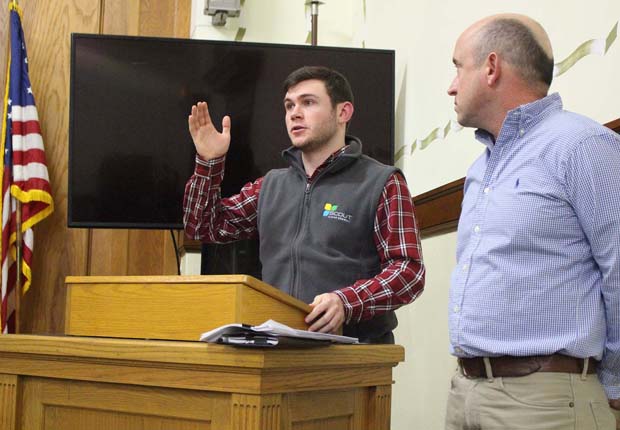 Zach Lasek and Mark Wengierski of Scout Clean Energy speak about plans for Sun Chief Solar at a Jay County Plan Commission meeting Thursday. The proposed $100 million, 100-megawatt solar energy facility will be located on about 1,200 acres northeast of Redkey, near Scout’s existing Bitter Ridge Wind Farm. It will have setbacks of about 30 feet from surrounding property lines and about 250 feet from nearby residences. (The Commercial Review/Bailey Cline)