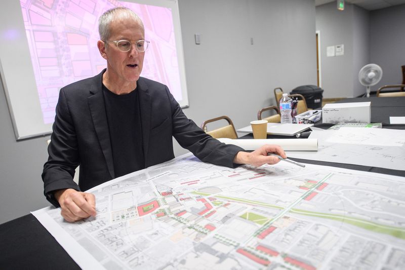 City planner Jeff Speck points out important areas in modified plans for Downtown Hammond on Thursday, August 8, 2019. (Kyle Telechan / Post-Tribune)