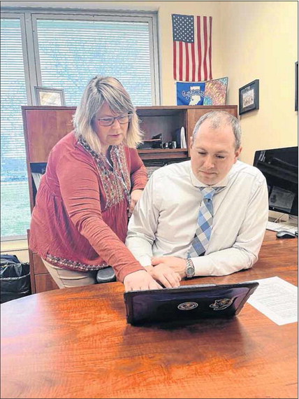 Assistant principals Susie Coleman and Nathan Bruck look at data to develop an effective vape diversion program for Greenfield-Central Schools. Submitted photo