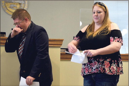Those days are over: Vaughn Cox laughs as his wife, Solitaire Cox, rips up an old book-in photo of Vaughn during the ceremony to celebrate his graduation from the Vigo County Veterans Treatment Court on Sept. 24, 2021, at the Vigo County Courthouse. Tribune-Star file/Joseph C. Garza