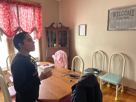 Jamie Rogers stands in the dining room of Peru’s All Things Are Possible recovery house in January. Rogers, a recovering addict, had been living in the house for about six months as of January as she worked to put her life back together. Staff photo by Jared Keever