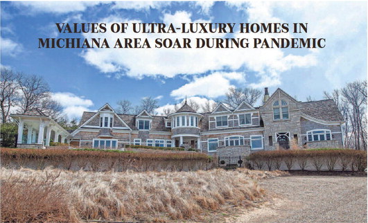 The outside of a home listed for sale for $5 million is shown on March 28 along Lake Park Drive, in the Grand Beach neighborhood of New Buffalo. Even with inflation and higher mortgage rates, demand is expected to remain strong for ultra-luxury homes. Staff photo by Robert Franklin