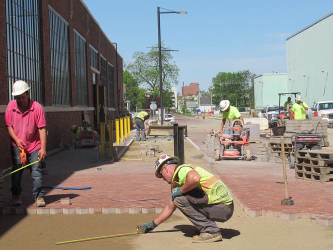Electric Works crews are laying a path of bricks to Broadway at the former General Electric complex in Fort Wayne. Photo by Mary Anne Gates