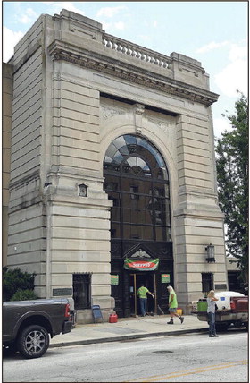 Cleanup crew: ServPro employees enter the building during cleanup at 643 Wabash Ave. on Friday, June 3, 2022. The building, which was once a First Financial Bank building, now belongs to Indiana Landmarks which is overseeing efforts to stabilize the structure. Staff photo by Joseph C. Garza