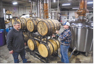 Jason and Jerrad Oakley check some of their barreled whiskey in the production area of Oakley Brothers Distillery in downtown Anderson in this THB file photo. Jason, an Army veteran, said leadership and team building skills he learned during his time in the military have helped him in his role as a small business owner. Herald Bulletin file photo

THB file photo