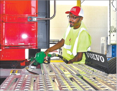 Darius Howell, a new driver in orientation at Carter Express, fills up his truck with fuel this week at the company’s corporate headquarters on West 73rd Street in Anderson. The cost of diesel fuel has nearly doubled from earlier this year. John P. Cleary | The Herald Bulletin