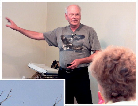 Eyes on the skies: Parke County bird-watcher Alan Bruner tells an audience in Clinton about the increasing abundance of bald eagles in Vermillion, Parke and Vigo counties. A watcher since 1973, Bruner said, "I've seen thousands of them." Staff photo by Mark Bennett