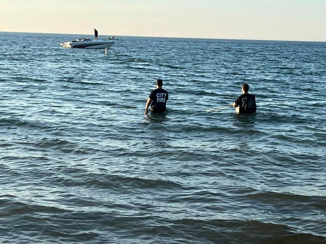 Michigan City Fire Department crews search for a possible drowning victim at Washington Park Beach, after pulling others from the water late Sunday afternoon, July 3, 2022. Michigan City Fire Department photo