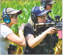 Alicia Heitz,

left, shown with a student during an all-female firearms training and safety class at Infinity Solutions LLC, said she often sees women get intimidated when they go to the shooting range with their male counterparts. Provided photo