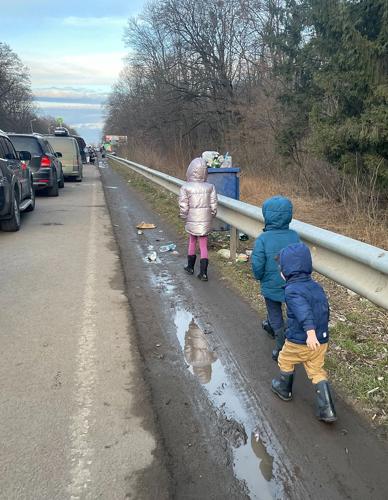 Ukrainian children walk to the Polish border with their parents not far behind. Provided photo