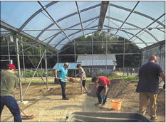 Building the greenhouse was a huge development for Watch Us Farm, thanks to expert Cisco Lunsford and a team of volunteers. Submitted photo