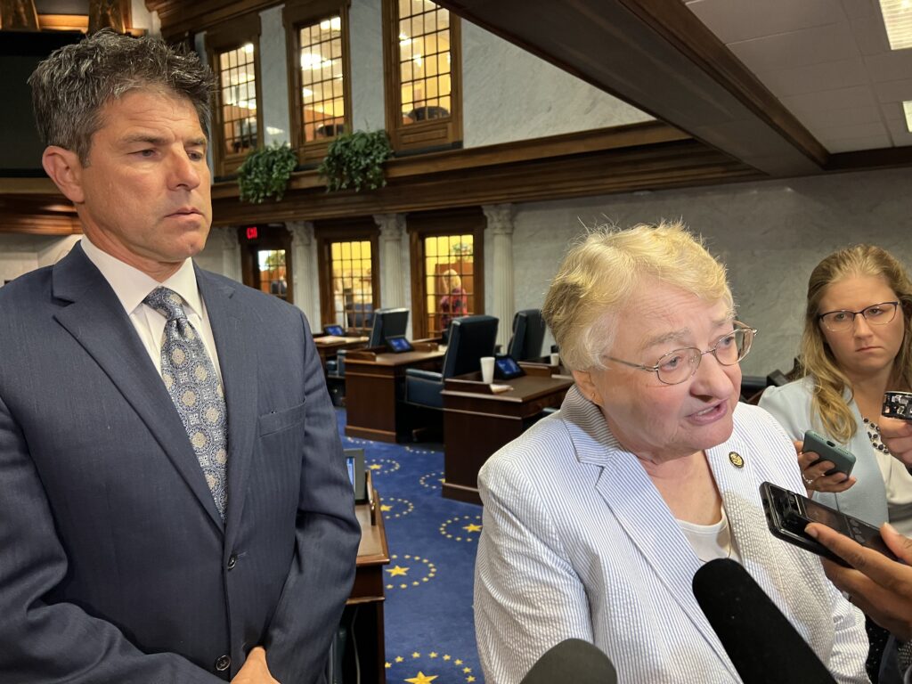 Sen. Sue Glick, R-LaGrange, answers questions from reporters following the passage of Senate Bill 1 Saturday. Senate President Pro Tem Rodric Bray (R-Martinsville) looks on. (Casey Smith/Indiana Capital Chronicle)