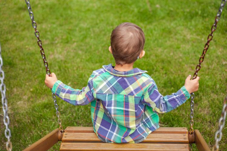 A foster child sits on a swing. The need for foster care in Indiana is high compared to most states. The new Indiana abortion law could create additional pressures on the system. 
Photo provided by The Villages of Indiana