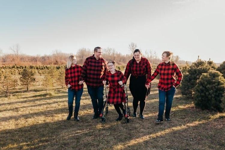 Mercede Gonzalez and her husband, Alex Springer, adopted three teenage sisters, including twins Jaimee and Jazmine and Nevaeh, who has cerebral palsy. The couple fostered the sisters for 18 months before adopting. Photo provided by Mercede Gonzalez