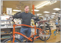 Larry Barnhart of Kokomo Schwinn Cyclery stands in front of a bike in for repairs at the store. Kokomo Tribune file photo