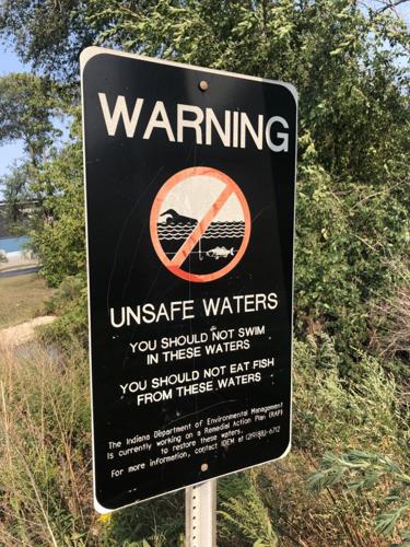 A sign warns water in the Grand Calumet River is unsafe. Staff photo by Joseph S. Pete
