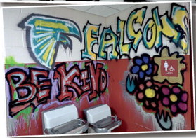 Inspired by artist Steven Raez, students at Benjamin Franklin Elementary School tried their own hand at graffiti art around one of the restrooms in the school. Staff photo by Steven Raez