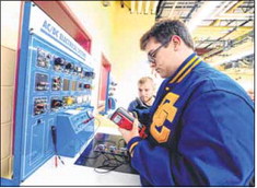 Greenfield-Central High School students Lee Paschal, left, and Brock Thomas work in an HVAC class in 2019. Hancock County leaders want to continue improving access to vocational education, with the ultimate goal of creating a stand-alone career center in the county. Daily Reporter file photo
