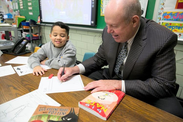 Hotel developer and philanthropist Bruce White meets with students, who were often the beneficiaries of his philanthropy. Provided image