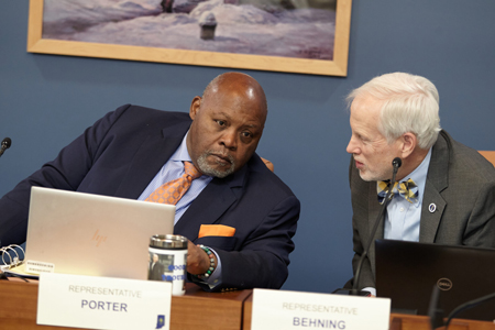 Rep. Greg Porter, D-Indianapolis, listens to colleague Rep. Robert Behning (R-Indianapolis) earlier this session in a committee. (Monroe Bush for Indiana Capital Chronicle)
