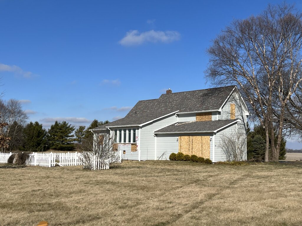  Some houses that were bought by the Indiana Economic Development Corporation in Boone County are already boarded up for future development. (Niki Kelly/Indiana Capital Chronicle)