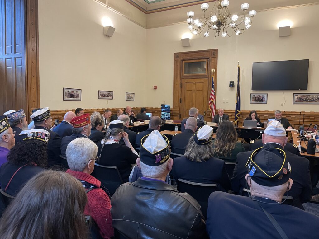 Veterans pack a committee room on Tuesday, March 7, 2023, as they await discussion of a bill that would strip Indiana National Guard members of the right to demand a military trial. (Leslie Bonilla Muñiz/Indiana Capital Chronicle)