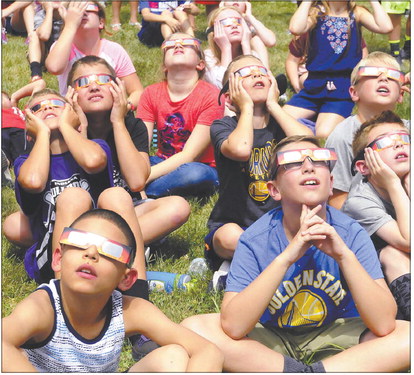 Students at Lapel Elementary School watch the solar eclipse in 2017. The next eclipse visible in Indiana will be in 2024. File photo | The Herald Bulletin
